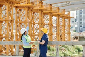 two workers analyzing an ongoing construction project