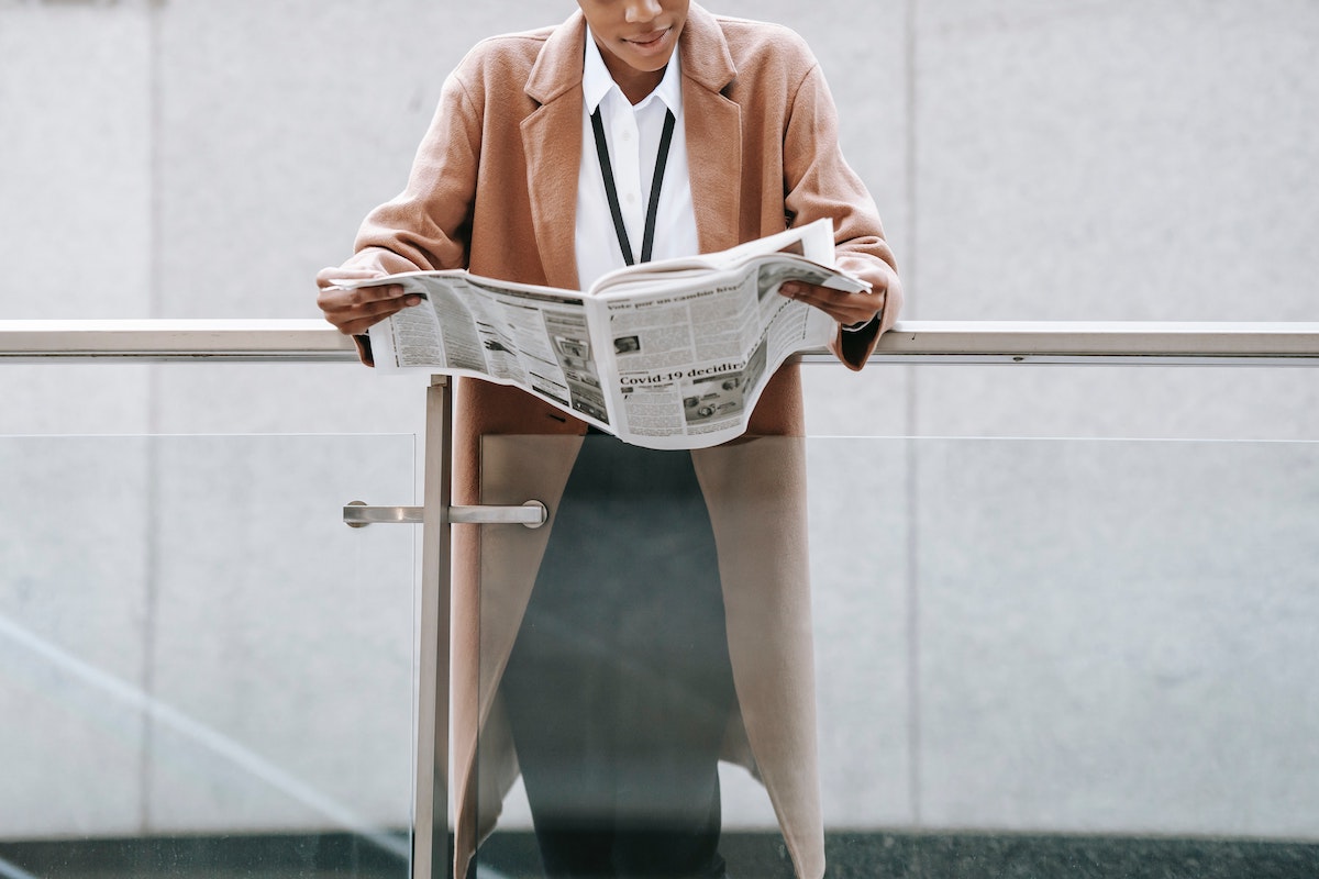 person reading newspaper