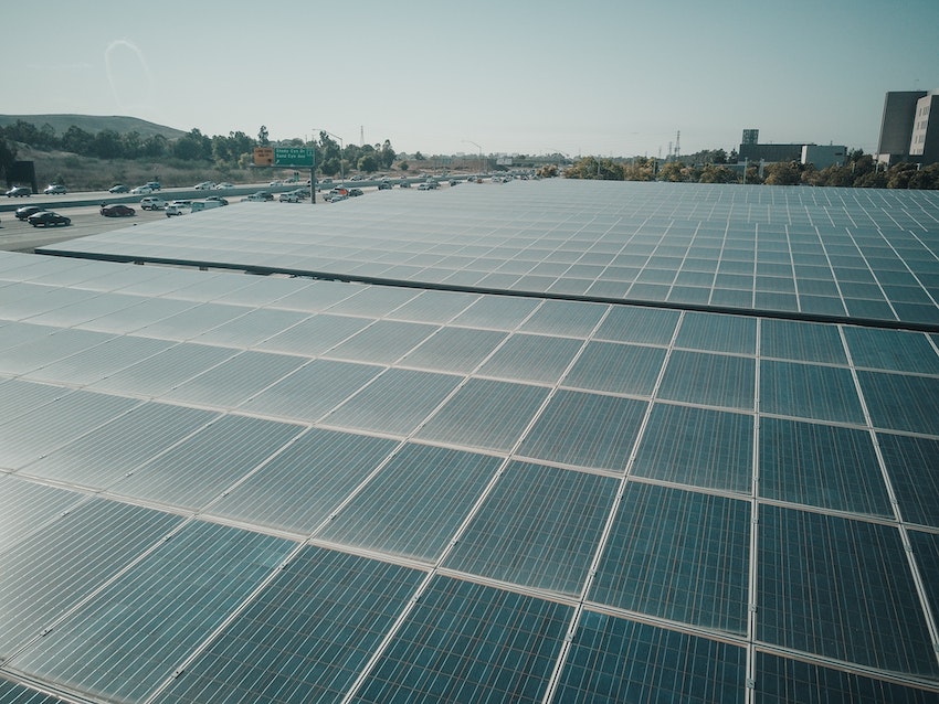 large display of solar panels next to interstate