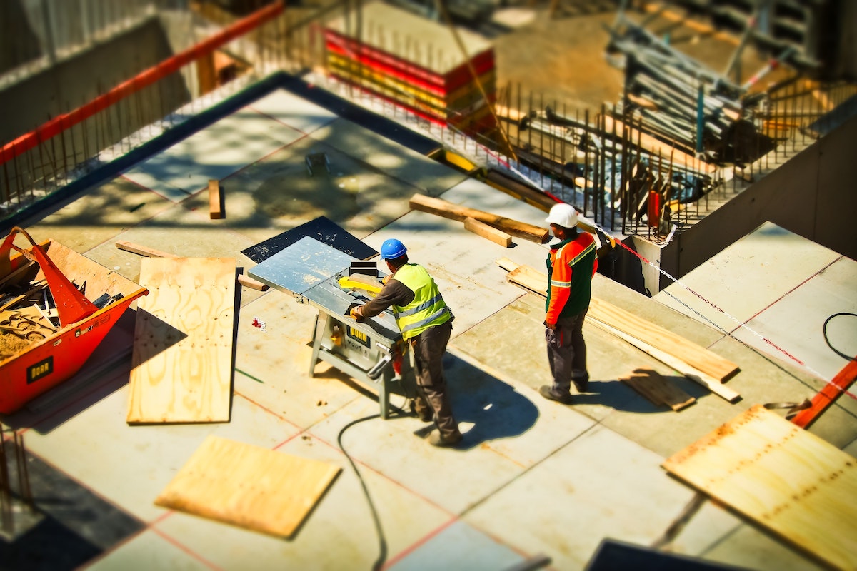 two workers on construction site