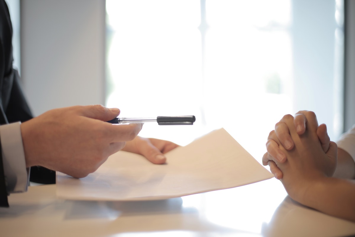 two people sitting at desk together